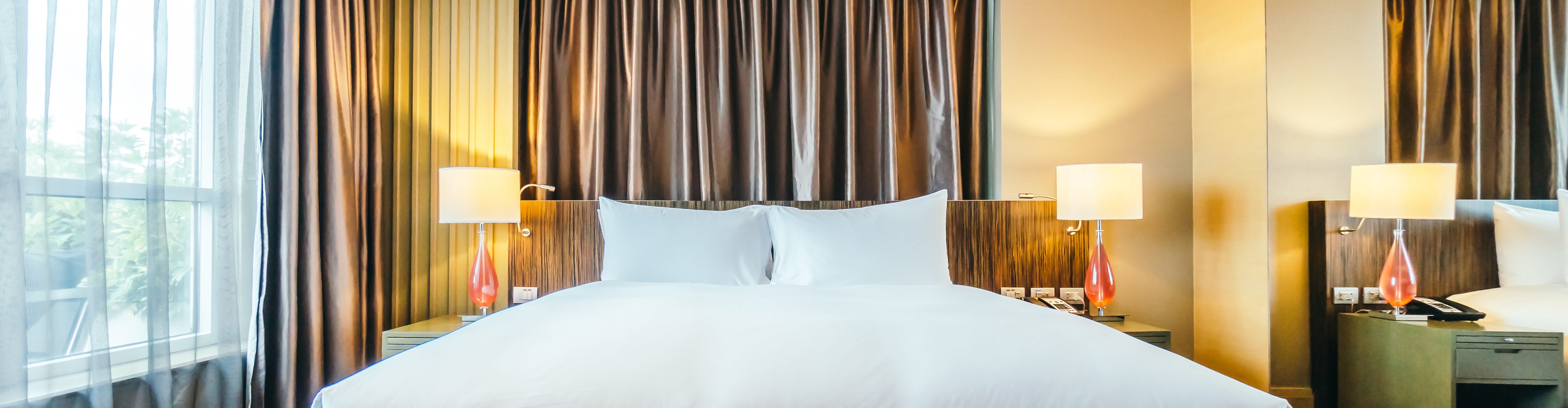 Hotel bedroom with layered linens